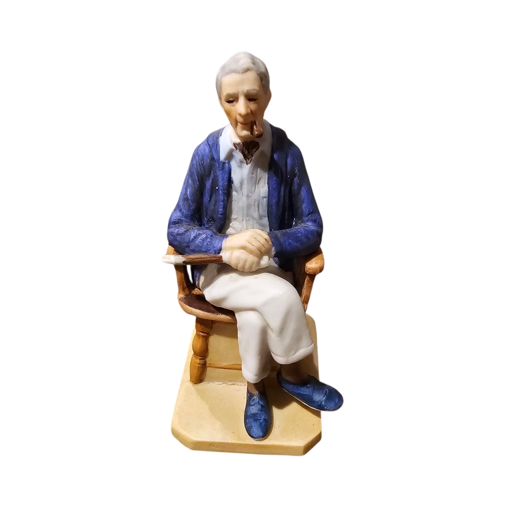 Norman Rockwell Blue and White Seated Figure Sculpture